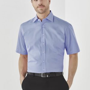 A short-sleeve men's button-up shirt in light blue, featuring a collar and a subtle texture. It has a logo on the chest.