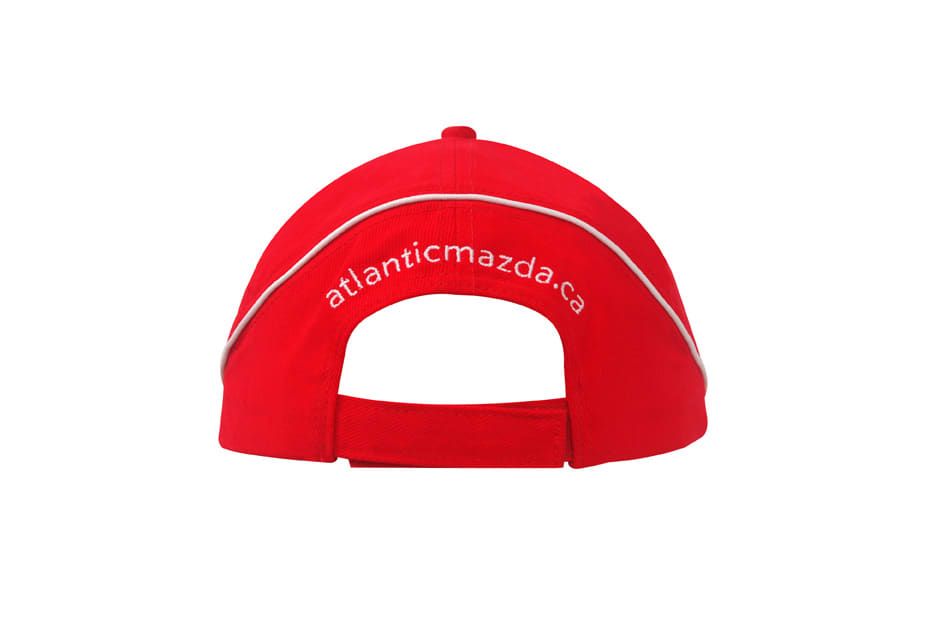 A red brushed heavy cotton cap featuring crown piping and a sandwich brim, with a logo on the back.