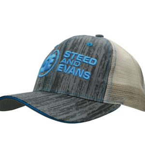 A cap featuring a wood print design, grey and beige colours, with a mesh back and a logo on the front.