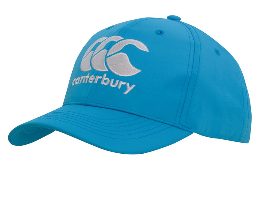 A blue sports cap with an embroidered logo, featuring a curved brim and adjustable strap at the back.