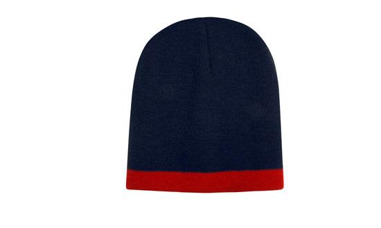 A two-tone beanie featuring navy blue and red colours, with a folded red cuff and a logo on the side.