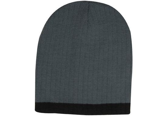 A two-tone cable knit beanie in grey with a black cuff and a logo on the side.