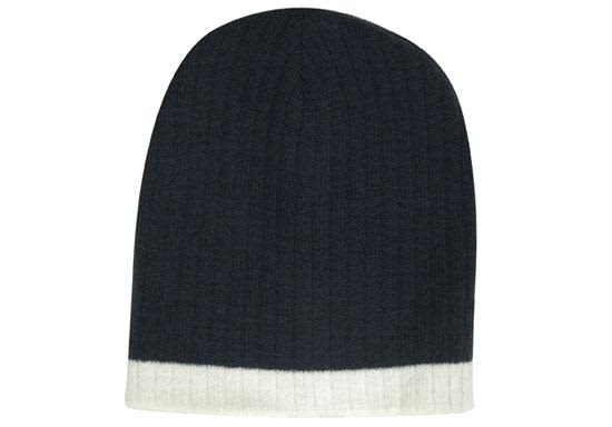 A two-tone cable knit beanie in dark navy blue with a light grey bottom band and a logo on it.