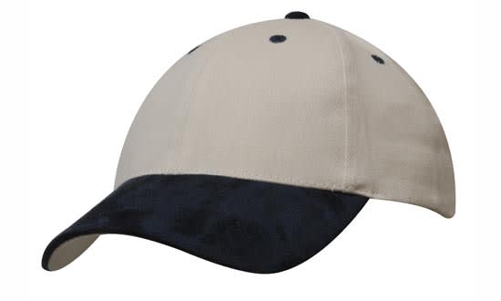 A brushed heavy cotton cap in cream with a navy suede peak and contrasting stitching. Features a logo on the front.
