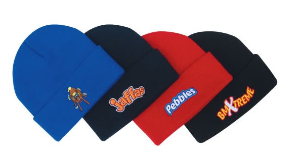 Four acrylic children's roll-up beanies in blue, red, and black, featuring various logos on each.