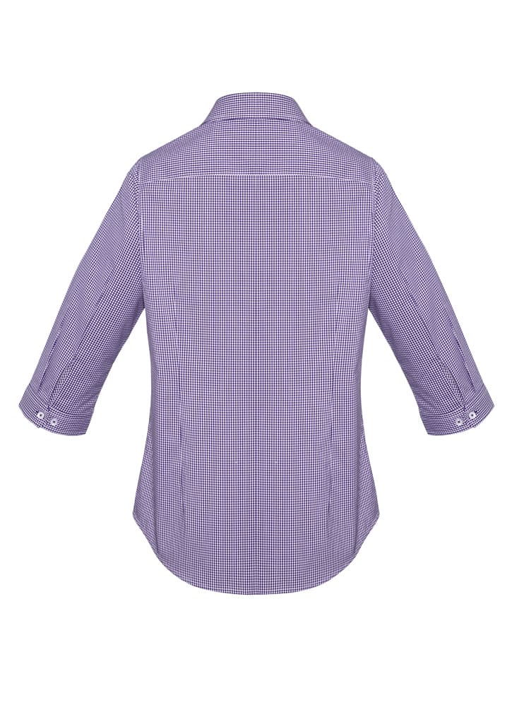 A women's purple checkered button-up shirt with 3/4 sleeves and a curved hem, featuring a logo.