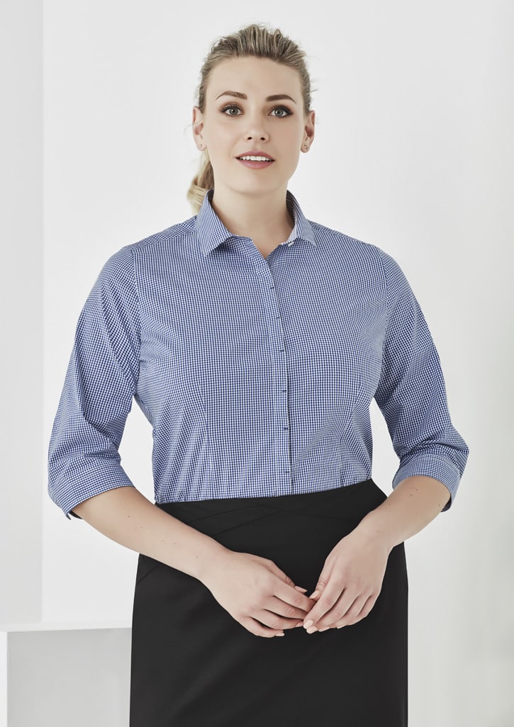 A blue and white checked 3/4 sleeve button-up shirt with a collar, featuring a logo on the fabric.