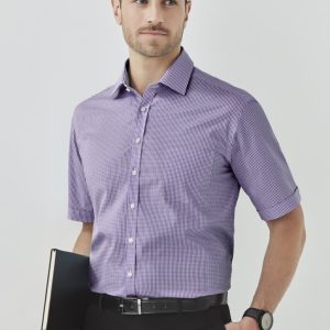 A short sleeve, button-up shirt in purple check pattern, paired with black trousers. Features a logo.