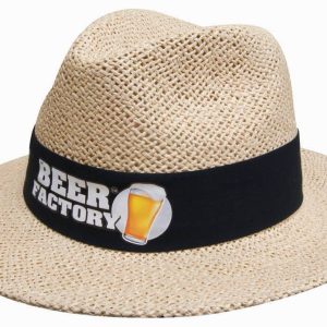 A natural straw hat with a black band and a logo. The hat has a wide brim and a classic style.