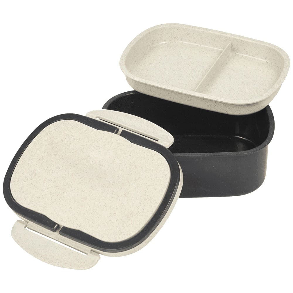 A plastic and wheat straw lunch box in cream and black, featuring two compartments and a lid. It includes a logo.