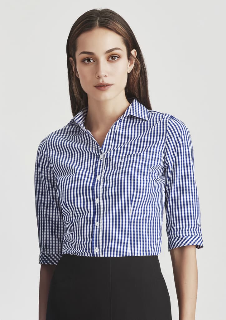 A fitted women's button-up shirt with 3/4 sleeves in a blue and white gingham pattern, featuring a collar and buttons.