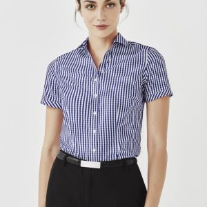A women's short sleeve button-up shirt featuring a blue and white gingham pattern. The shirt has a collar and a logo.