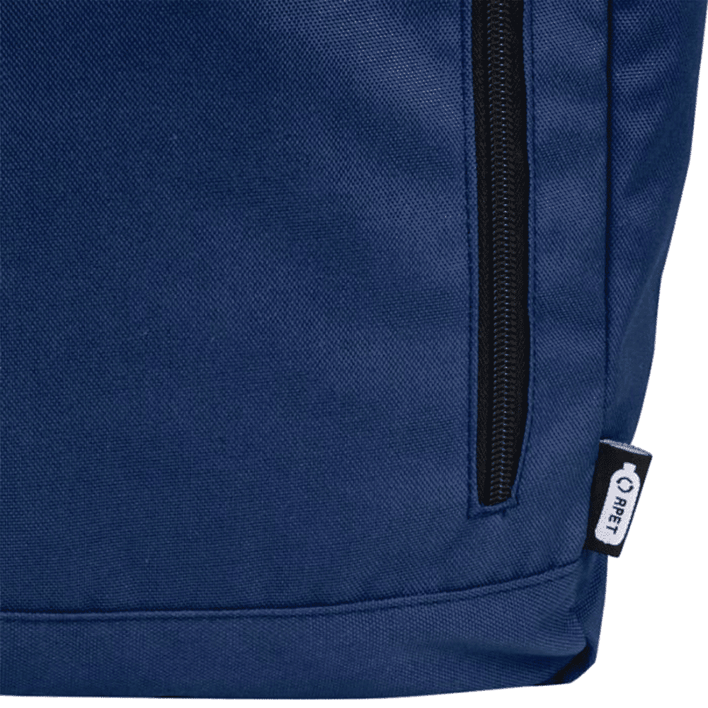 A blue roll-top backpack with a zippered pocket and a small logo tag on the side.