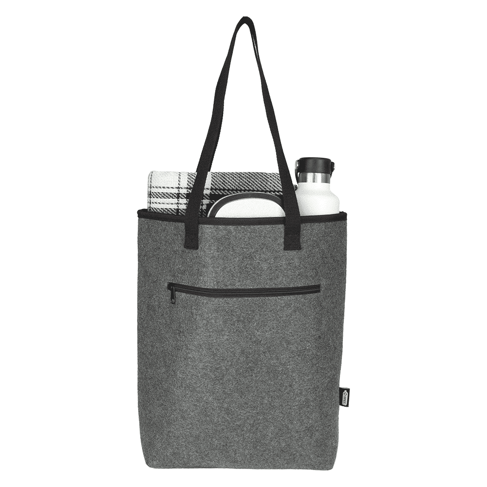 A grey recycled felt cooler tote bag contains a drink bottle, a towel, and features a pocket and black handles.