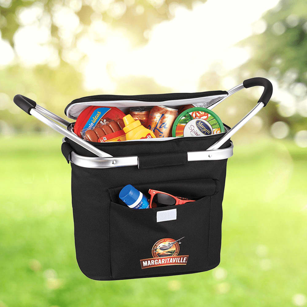 A black picnic cooler filled with cans, condiments, and snacks, featuring a pocket and a logo.