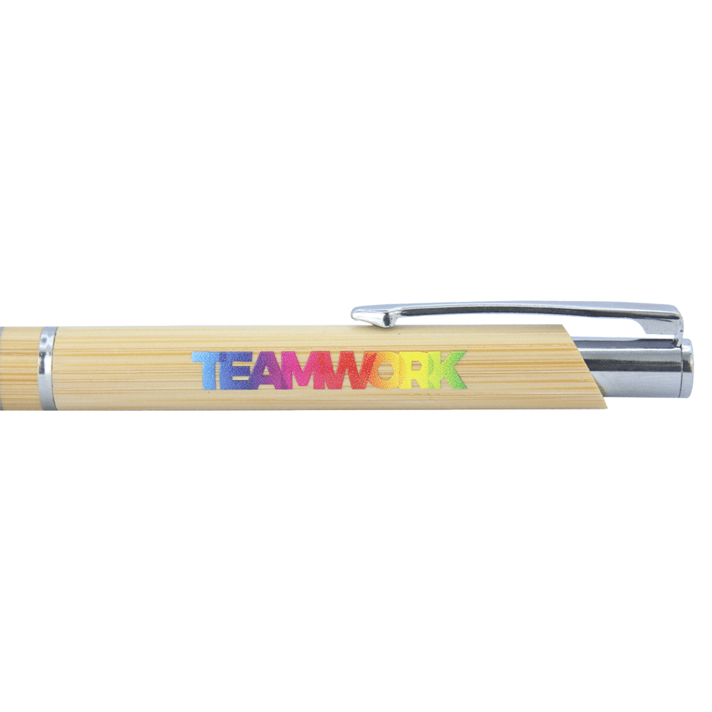 A bamboo ballpoint pen featuring a chrome clip and an iridescent logo. The pen is predominantly light brown.
