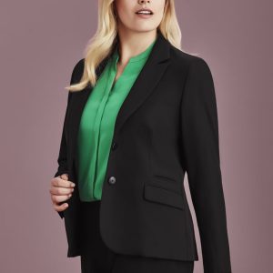 A black mid-length women's jacket is styled with a green blouse. The jacket features a fitted design and has a logo.