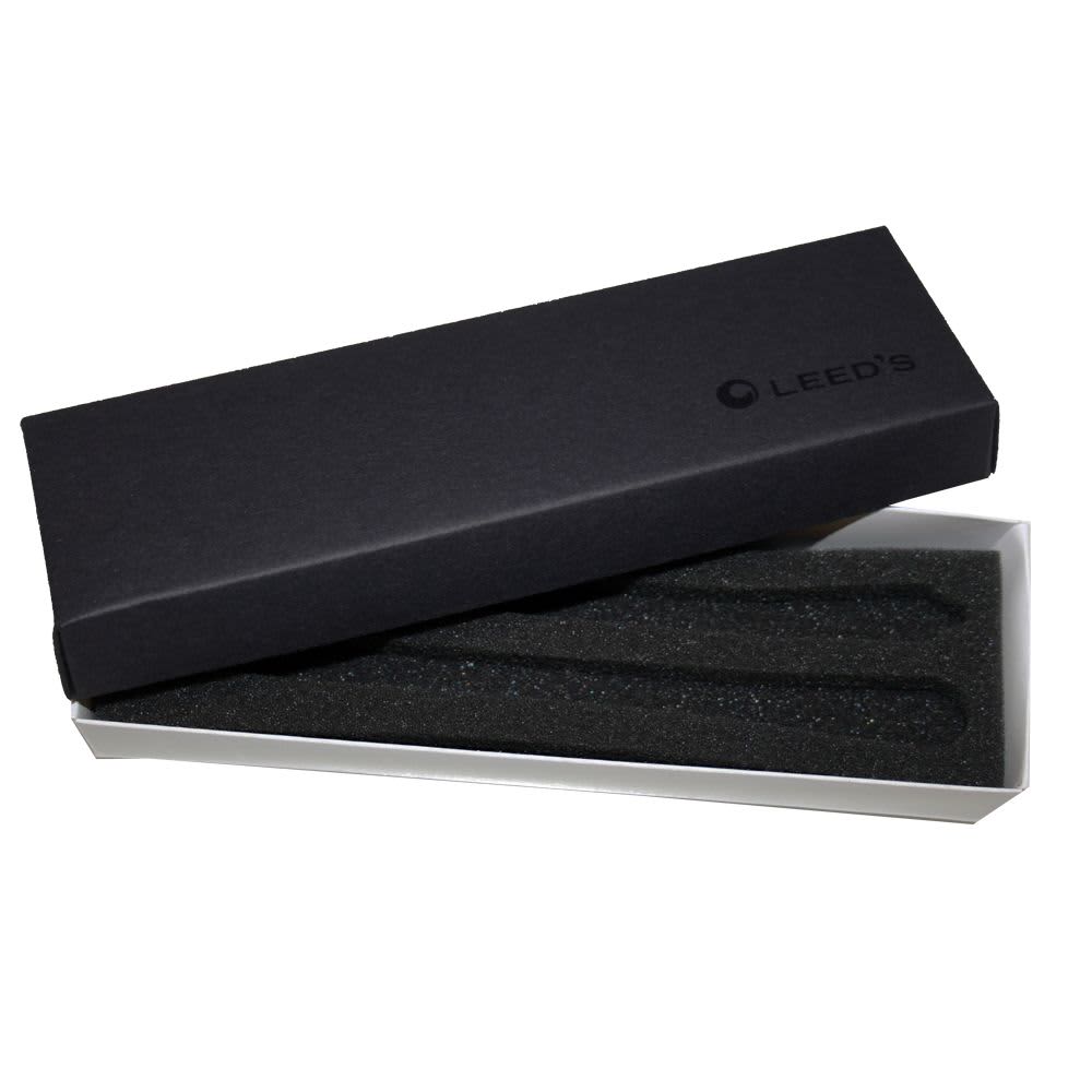 A black double pen box with a foam insert, featuring a white base and a logo on the lid.