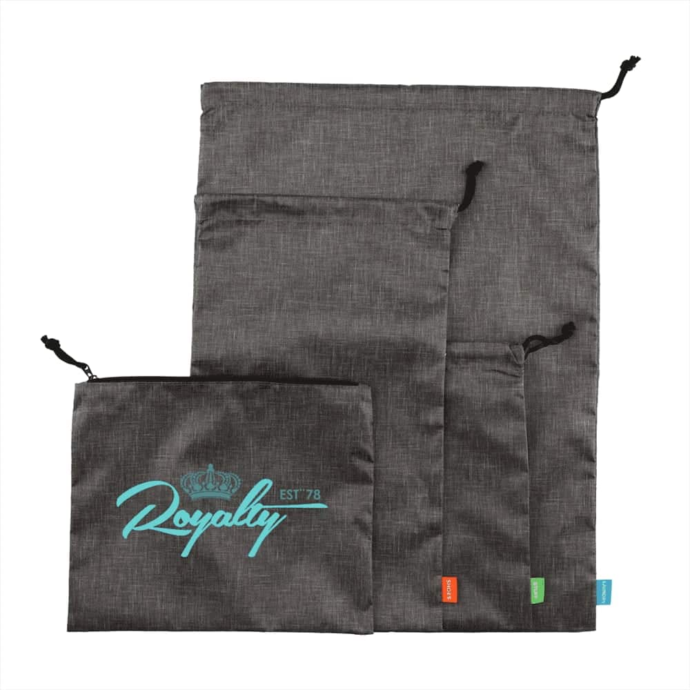 A set of grey toiletry bags in various sizes, featuring a logo on the largest bag.