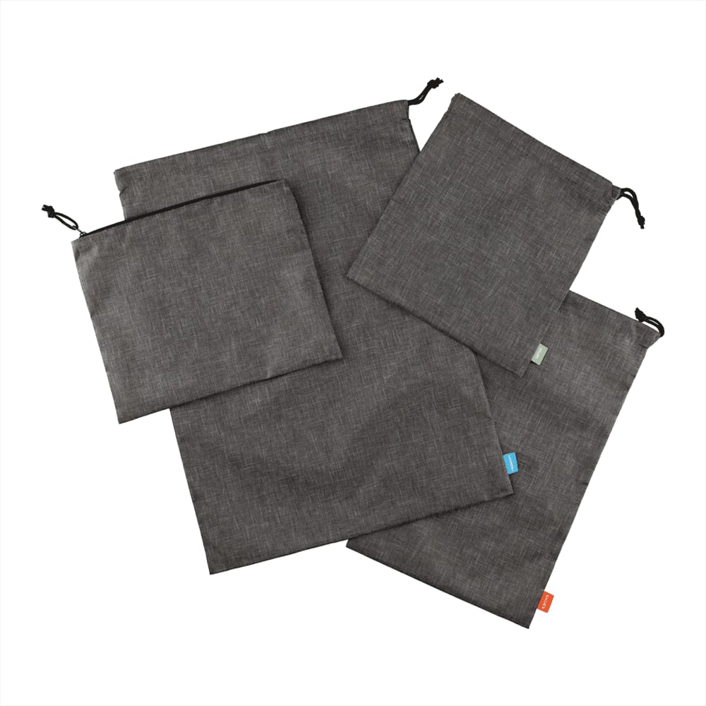 A set of four grey recycled clean bags featuring drawstring closures and a variety of sizes.