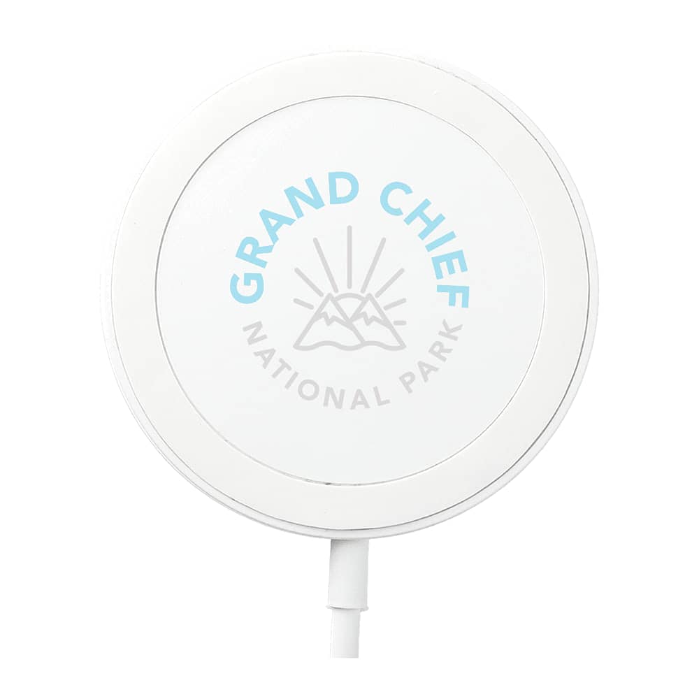 A white wireless charging pad with a circular design and a logo featuring mountains and text.