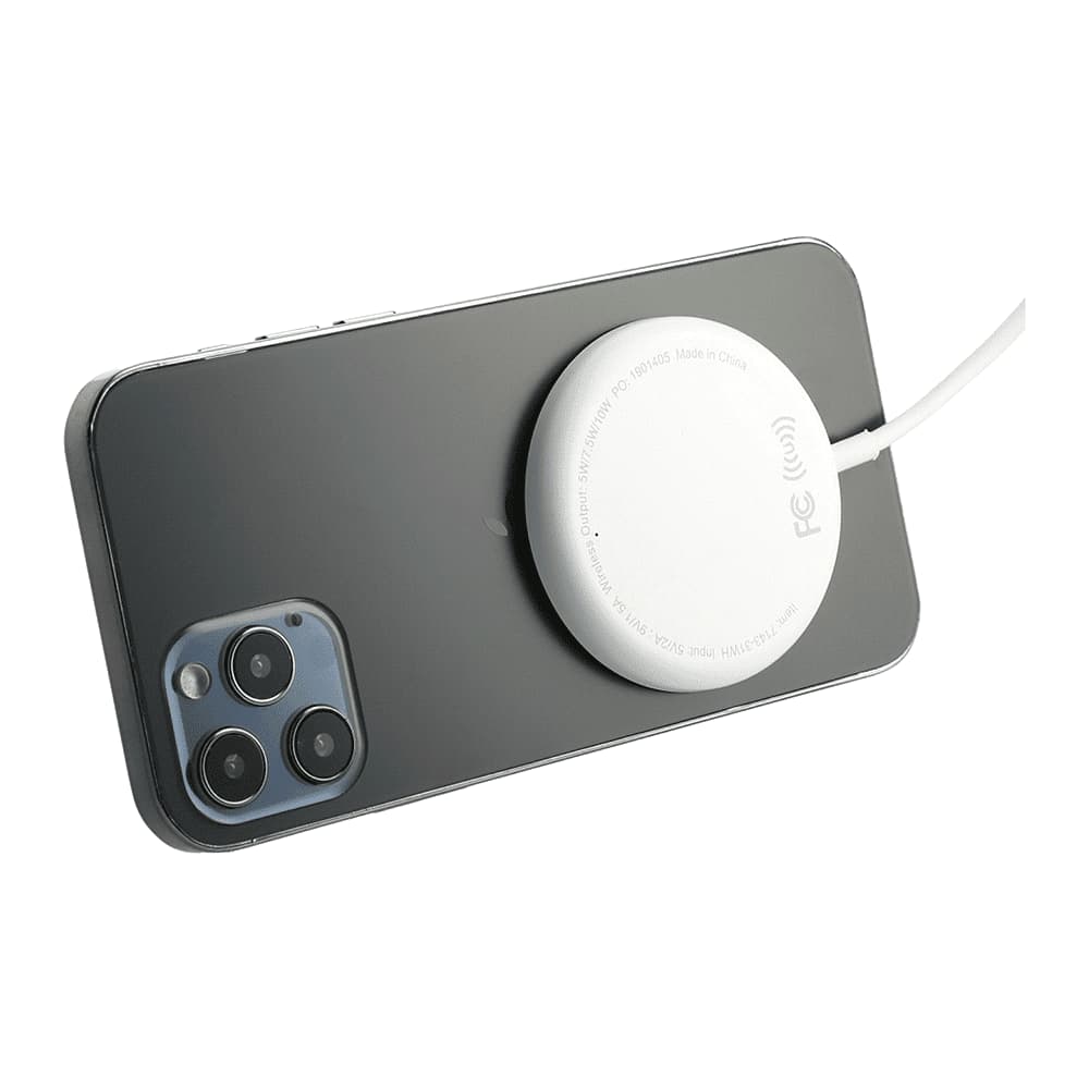 A white wireless charging pad is connected to a black smartphone, showcasing a sleek, modern design.