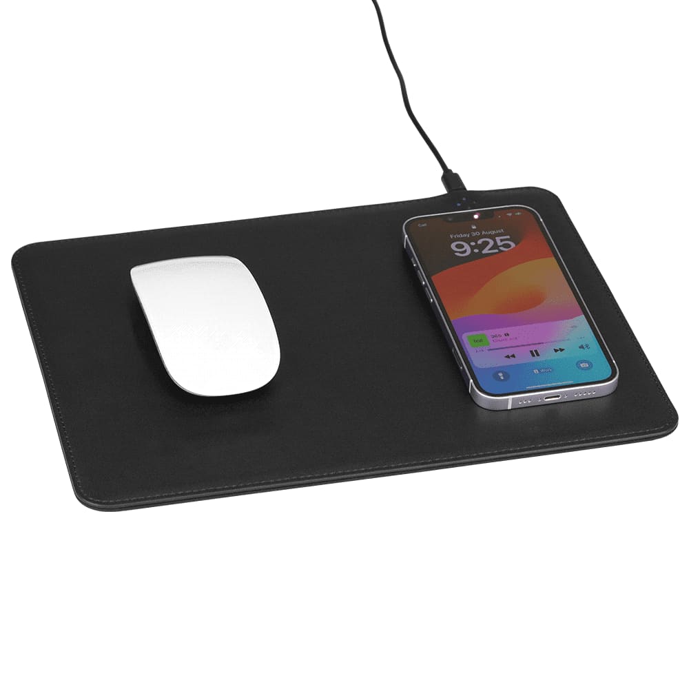 A black wireless charging mouse pad with a white mouse and a smartphone on it, connected by a charging cable.