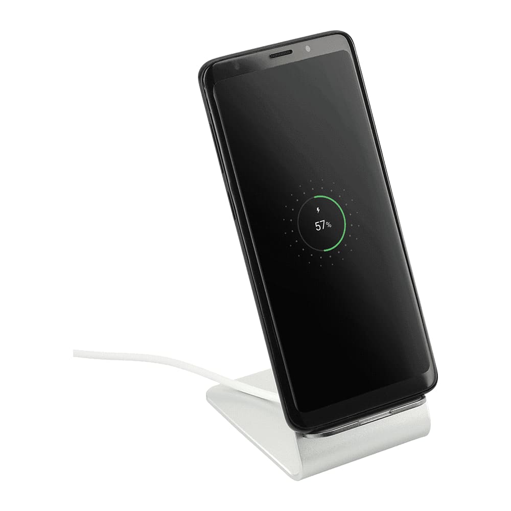 A wireless charging stand in silver with a sleek design, supporting a smartphone in an upright position.