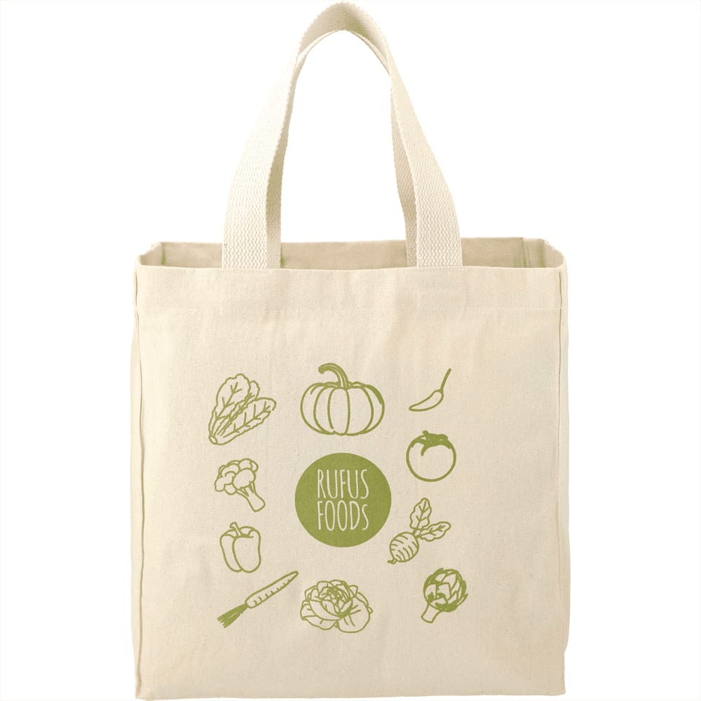 A cream-coloured reusable grocery tote with an illustration of various vegetables and a logo.