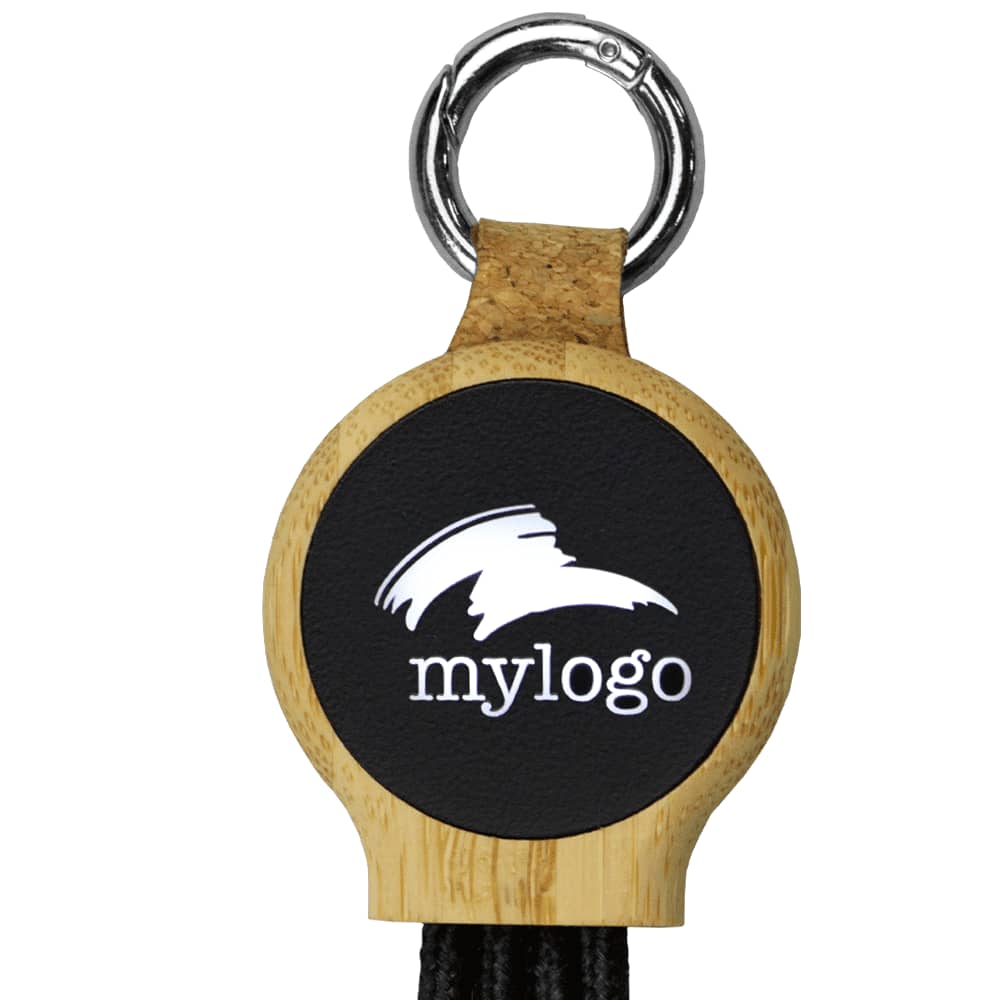 A circular keyring made of bamboo with a black insert and a charging cable attached. The keyring features a logo.