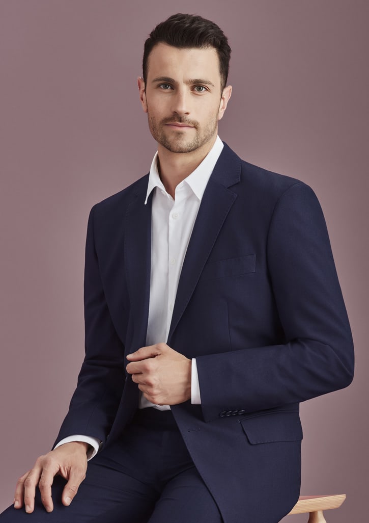 A navy blue men's blazer with a two-button design, featuring a single chest pocket, modelled by a man.