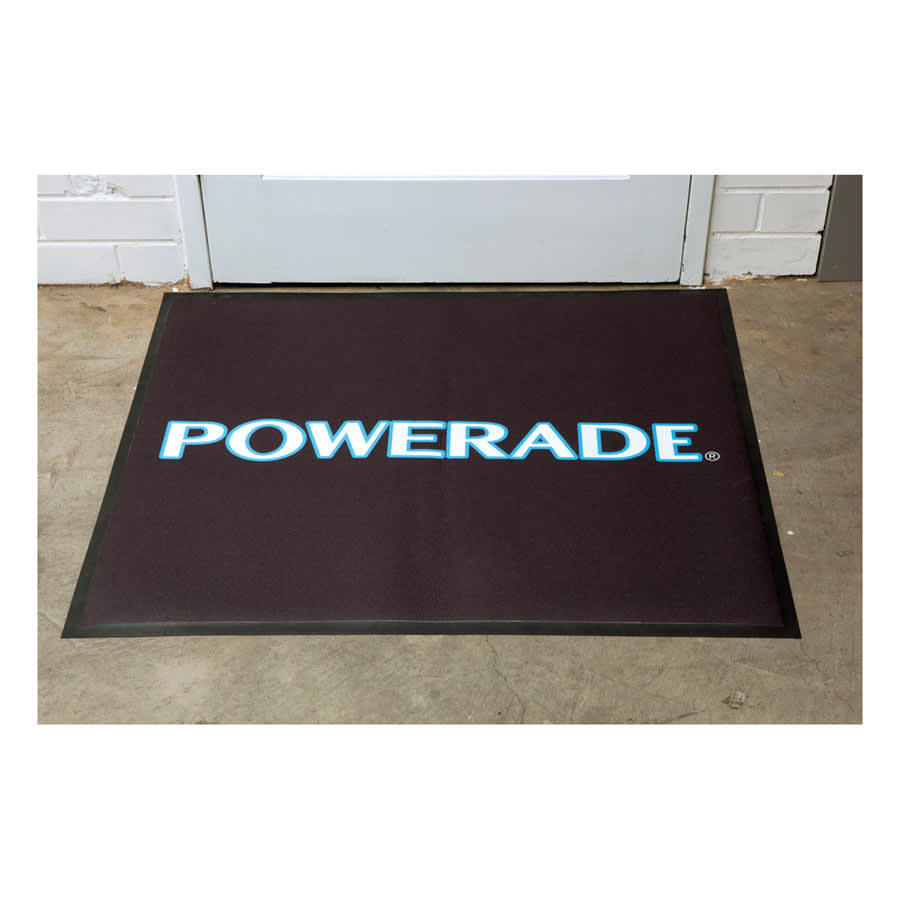 A black floor mat with a logo featuring the word 