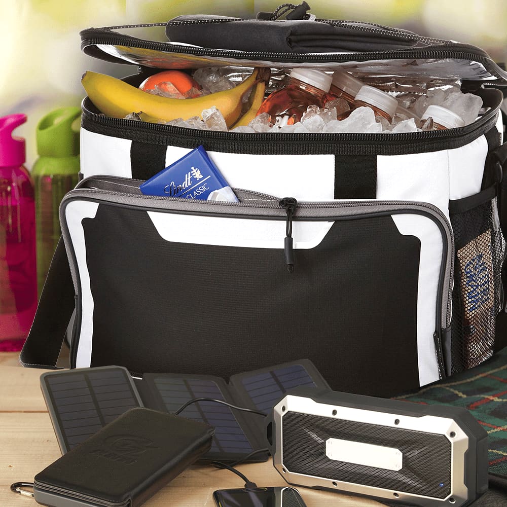 A black and white cooler bag filled with ice, drinks, and fruit, featuring a front pocket and a logo.
