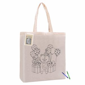 A natural calico tote bag featuring a bear design with balloons and gifts, alongside a crayon for colouring.