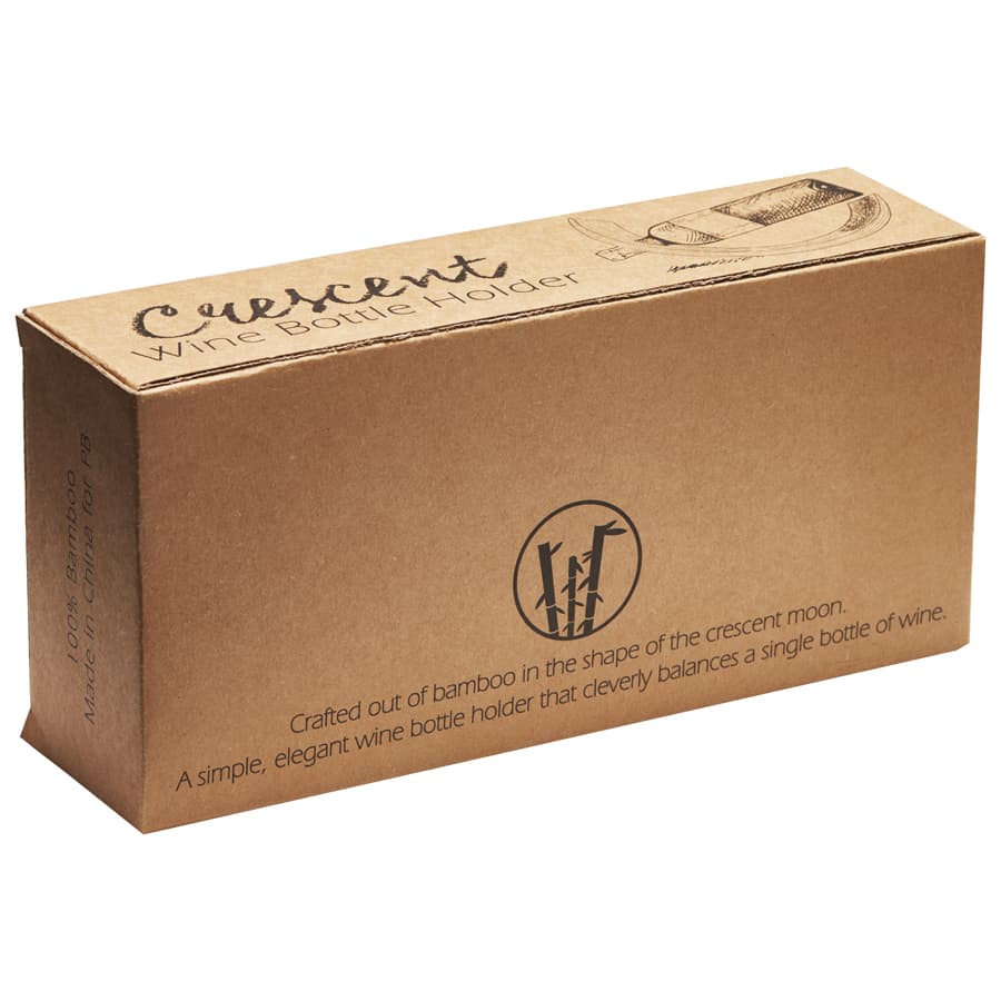 A wine bottle holder in a crescent moon shape, crafted from bamboo, presented in a brown cardboard box with branding.