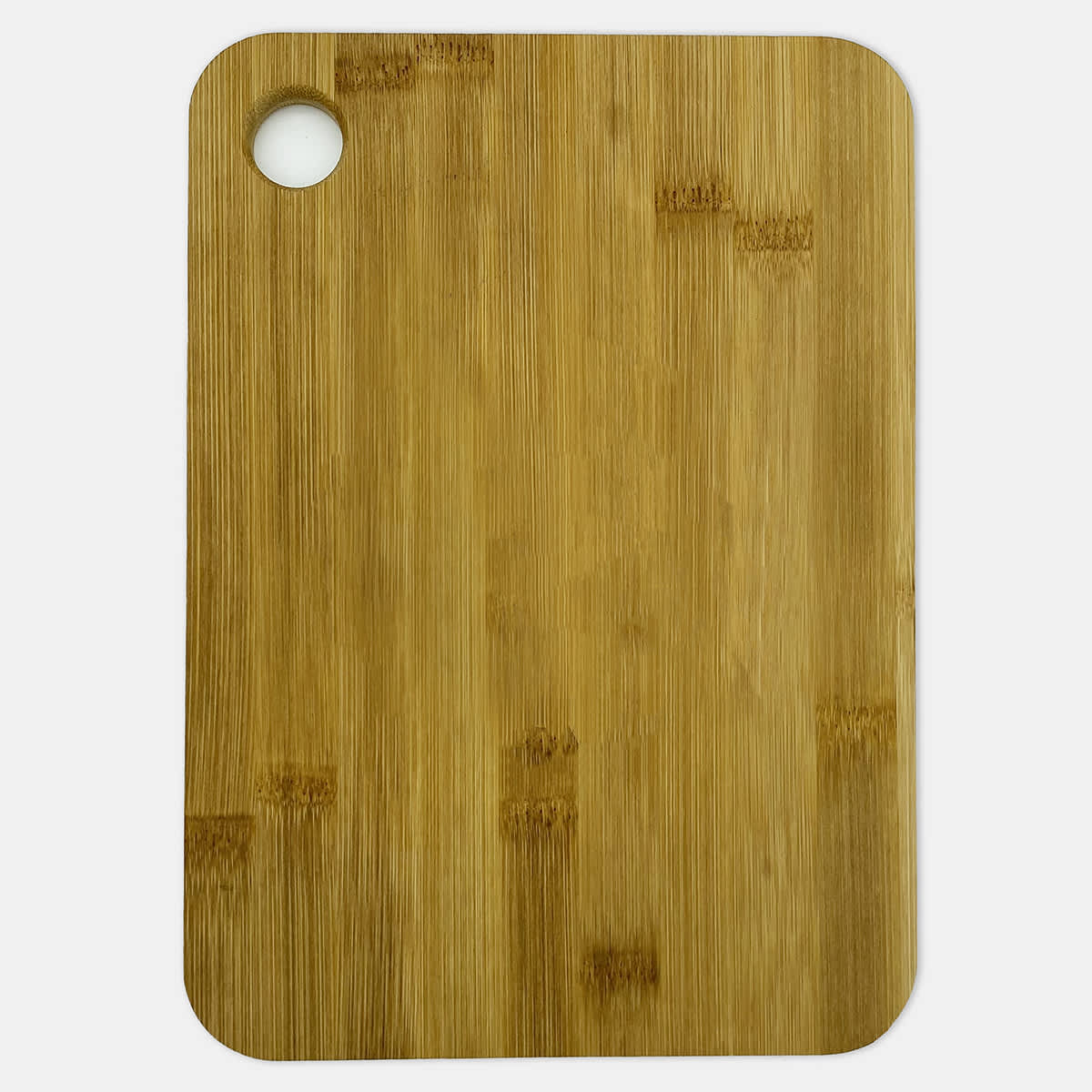 A large bamboo cutting board with a round hole in one corner, featuring a natural light brown finish.