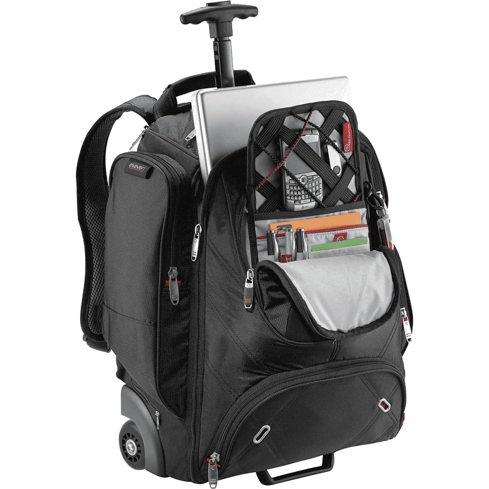 A black wheeled backpack with multiple compartments, revealing items like books and a drink bottle inside.