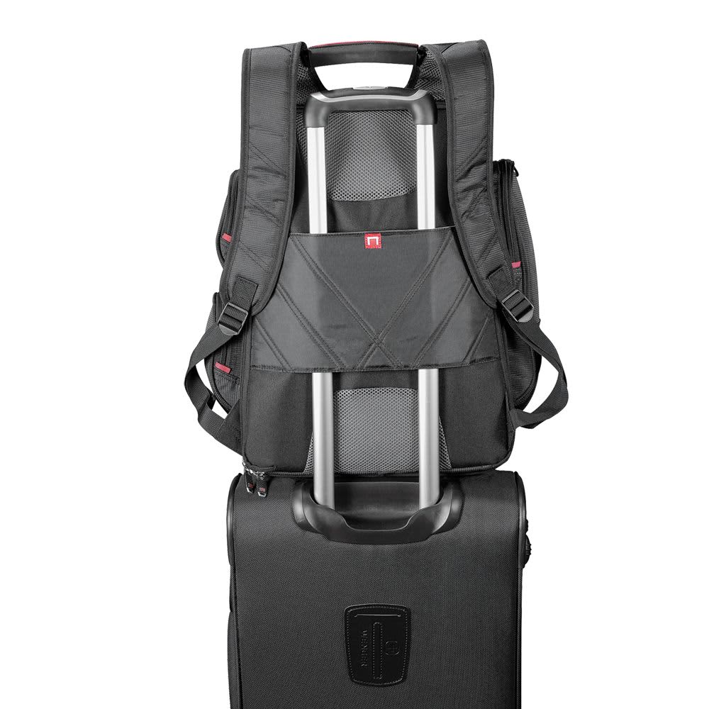 A grey backpack with multiple compartments sits atop a black suitcase, featuring a pull handle. It has visible branding.