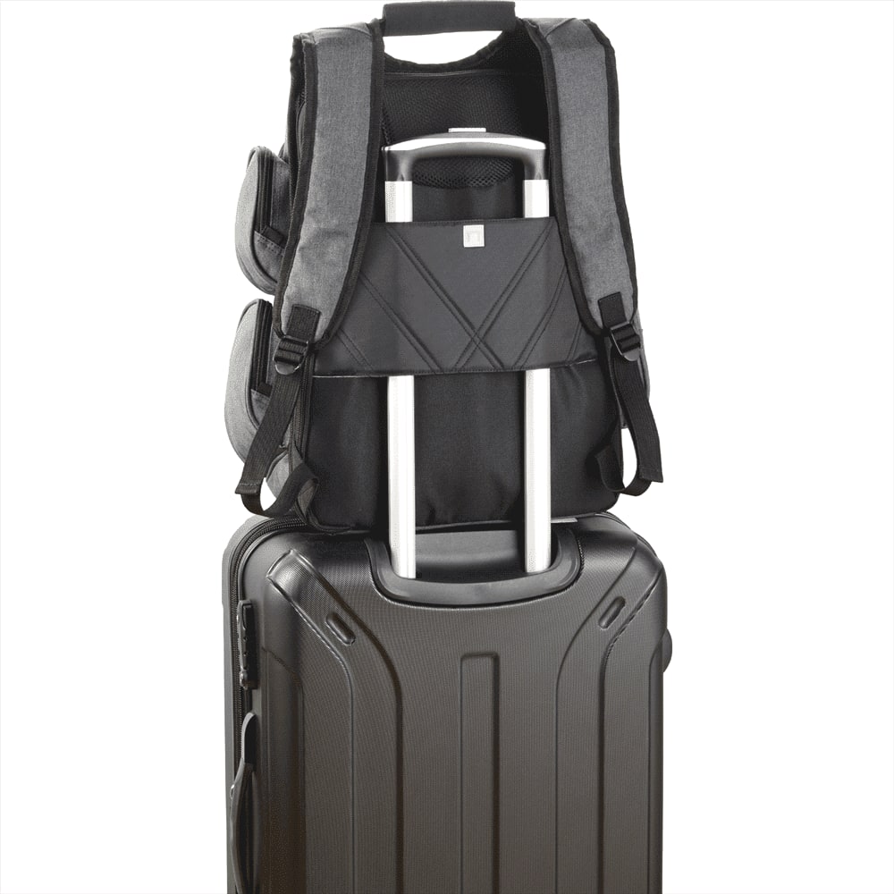 A black backpack interior featuring compartments with red accents and a USB flash drive attached.