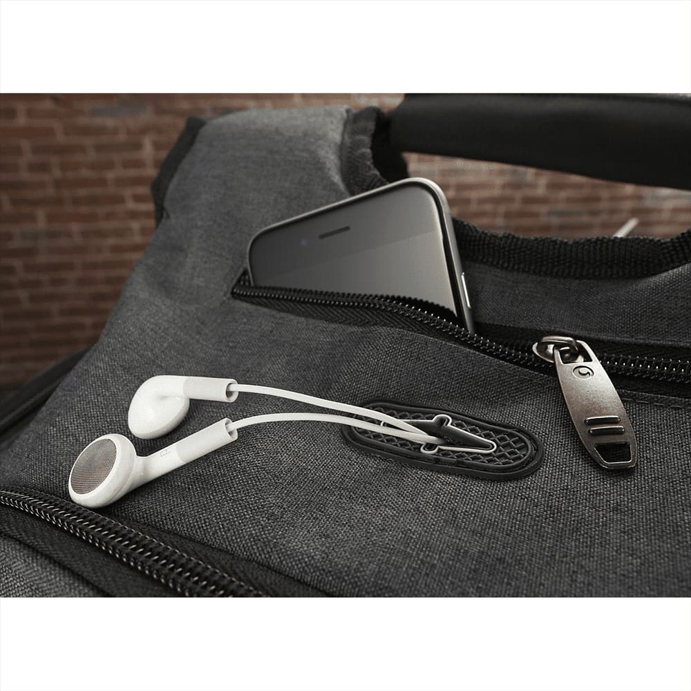 A grey backpack with multiple pockets, featuring a padded compartment for a laptop and an open design.