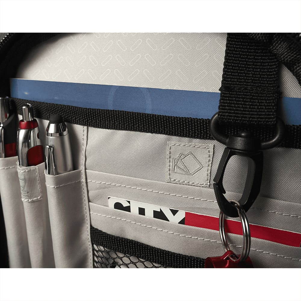 A black checkpoint-friendly backpack featuring multiple storage compartments and straps for easy transport on a trolley.