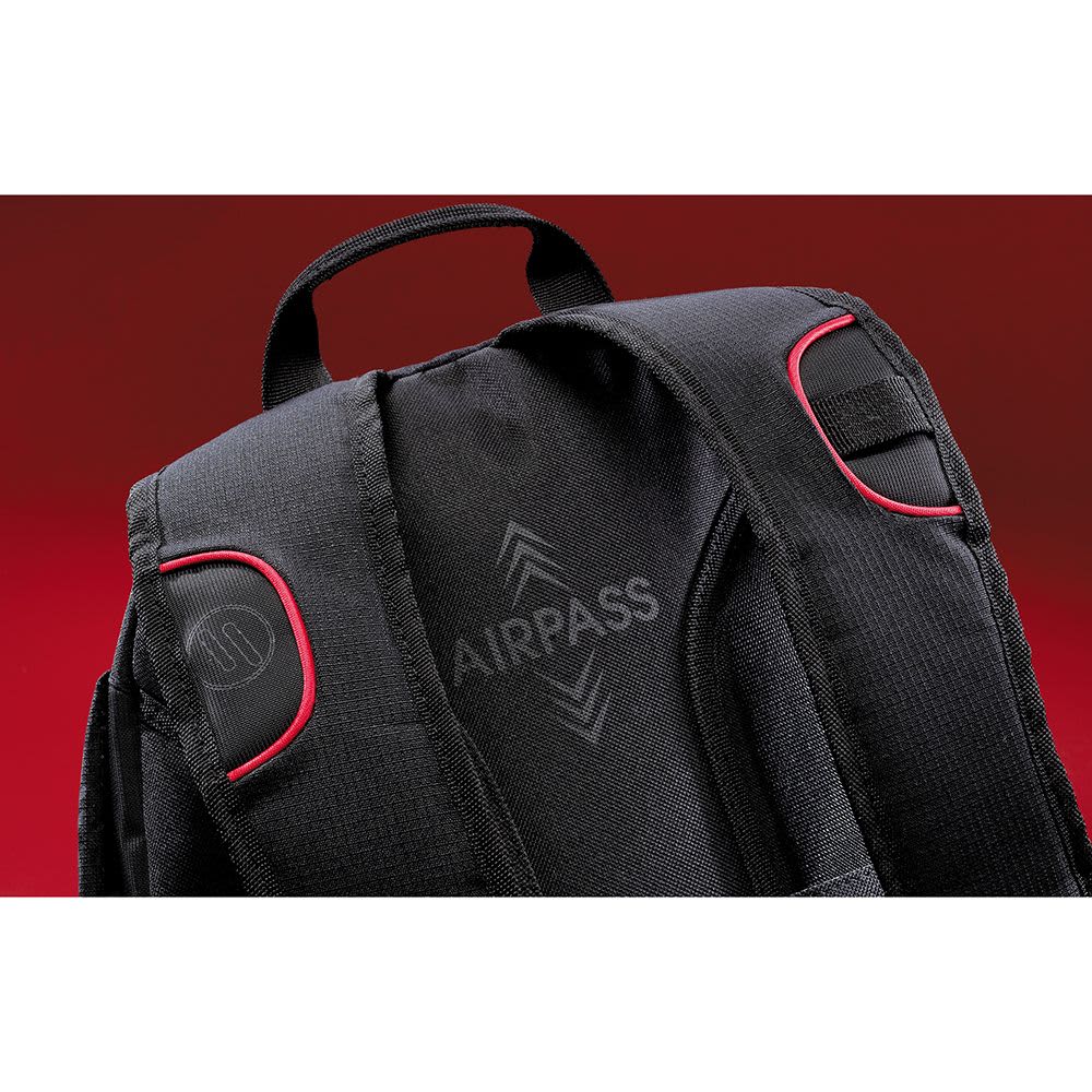 A black backpack with red accents and sunglasses resting on one strap. It features padded back support and has a logo.
