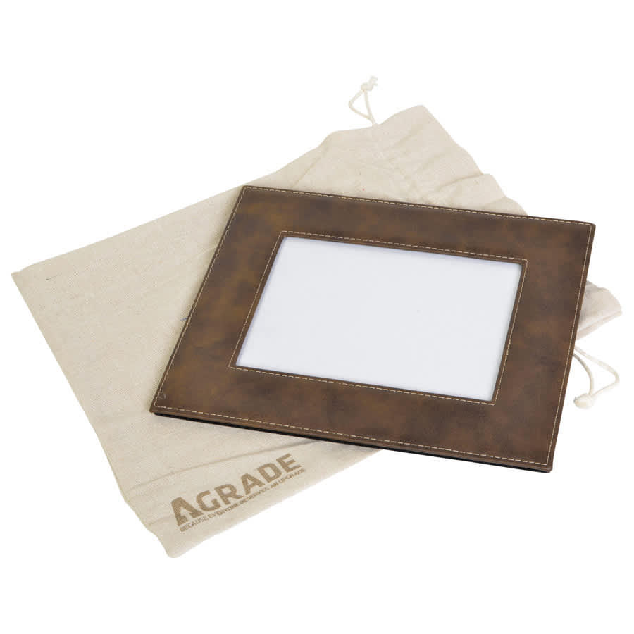 A brown 5x7 photo frame with a textured finish, accompanied by a cream-coloured drawstring bag featuring a logo.