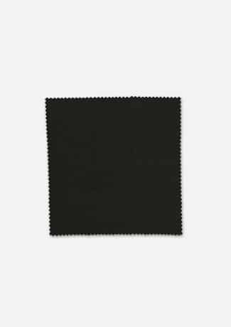 Black comfort wool stretch suiting fabric swatch displayed on a light grey background, featuring a fine textured weave with pinked zigzag sample edges for tailoring and apparel customisation reference.