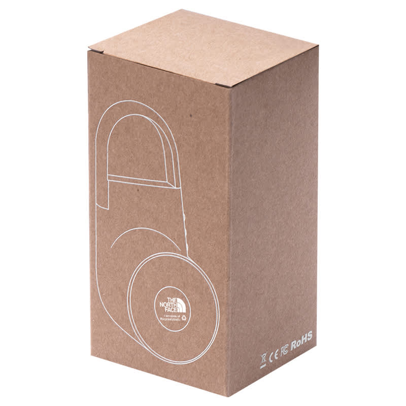 A tan cardboard box containing a black wireless outdoor speaker, featuring a logo and a modern design.
