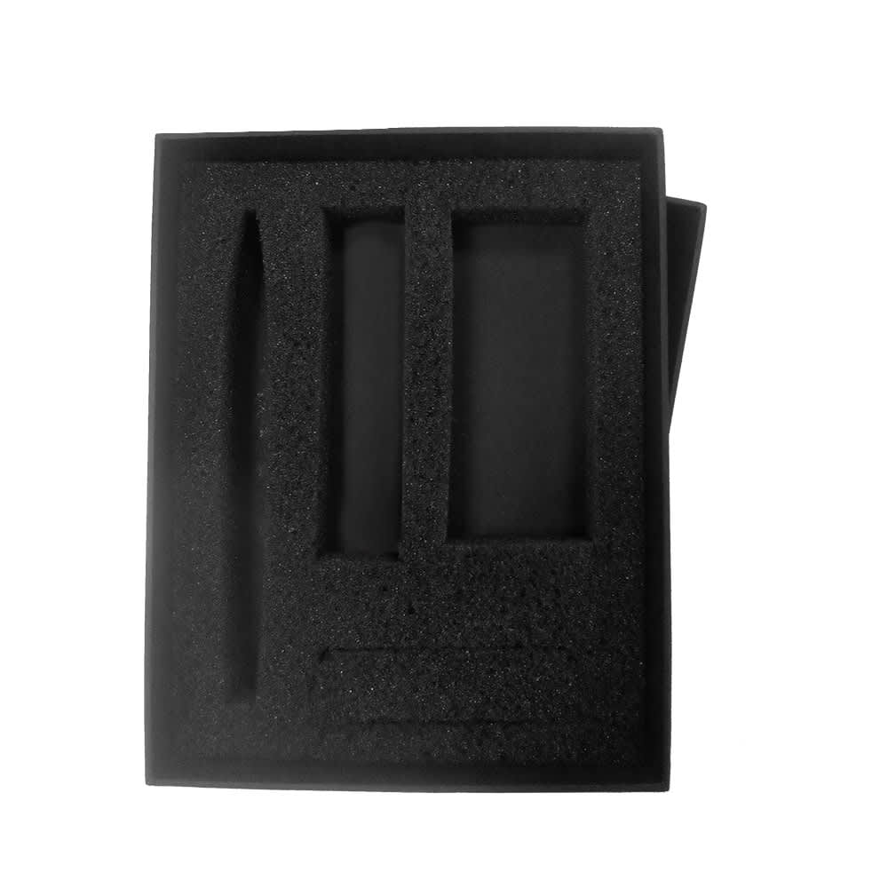 A black gift box containing a power bank, cable, and pen, all securely held with foam padding.
