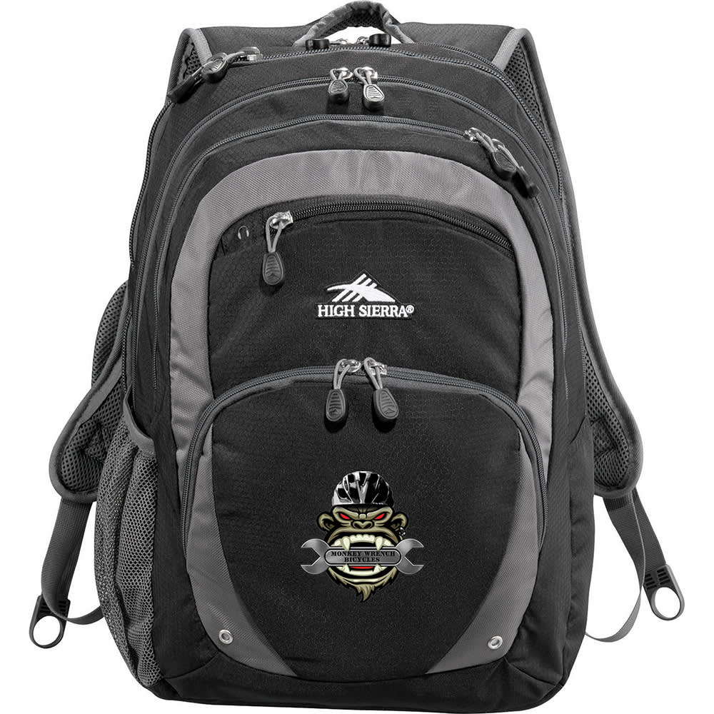 A black and grey backpack with multiple zippered compartments and padded straps, featuring a logo.