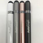 Four metal pens in silver, rose gold, grey, and black, featuring a logo on each pen.