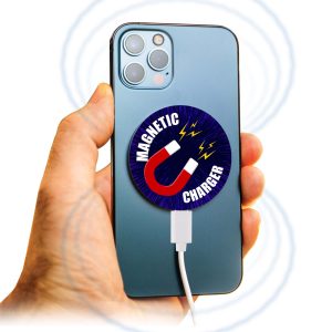 A hand holding a smartphone with a round, blue and white magnetic wireless charger attached to the back.