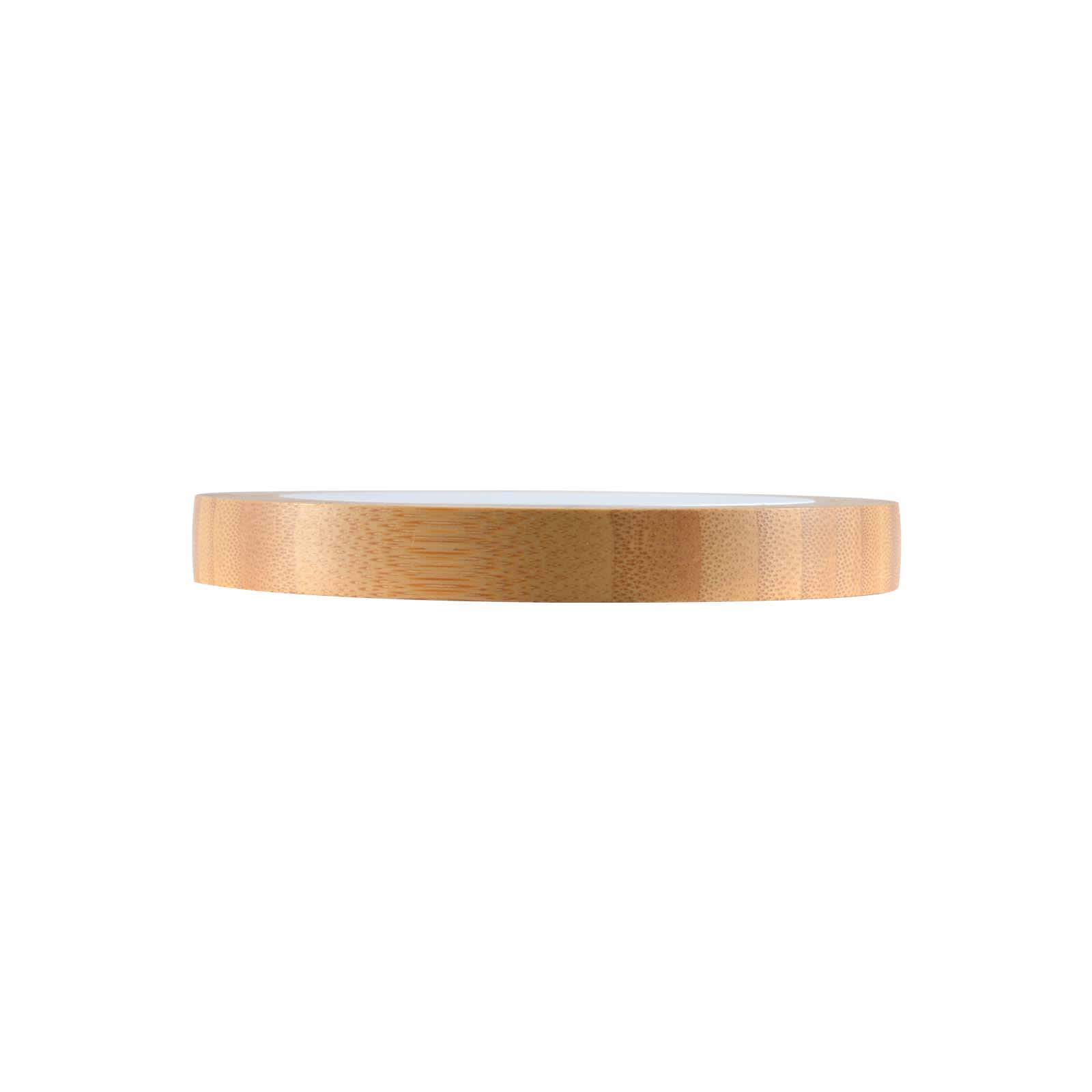 A bamboo wireless charger with a sleek, circular design and a smooth surface, featuring a natural wood finish.